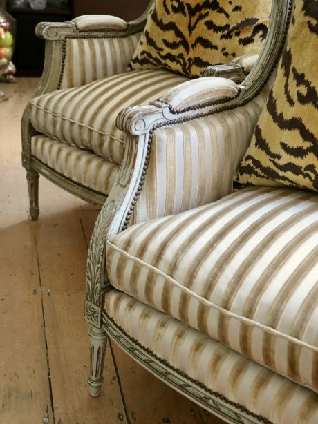 A pair of painted Louis XVI style wingchairs c.1950