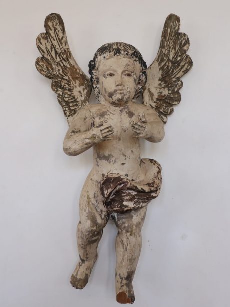 An antique Spanish hand carved and painted wooden putti c.1870
