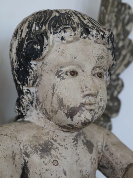 An antique Spanish hand carved and painted wooden putti c.1870