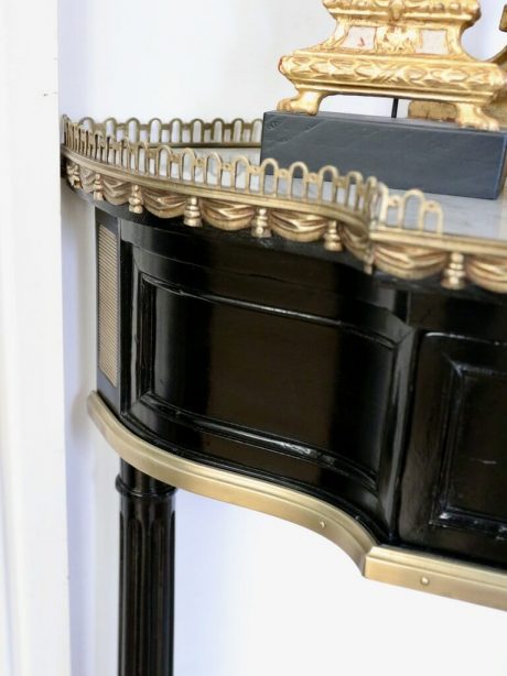 A French mid century Louis XVI style corner ebonised console