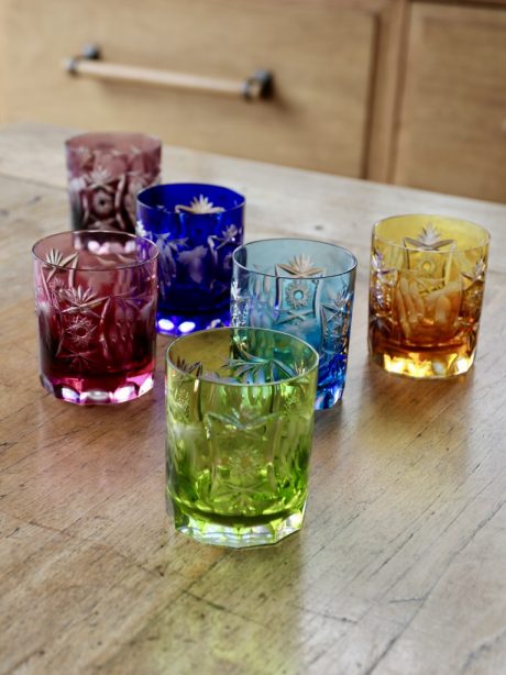 A set of six coloured crystal whiskey tumblers by Nachtmann