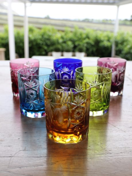 A set of six coloured crystal whiskey tumblers by Nachtmann