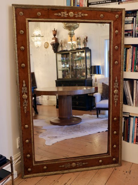 A large Empire velvet framed mirror c.1820