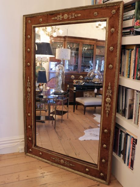 A large Empire velvet framed mirror c.1820