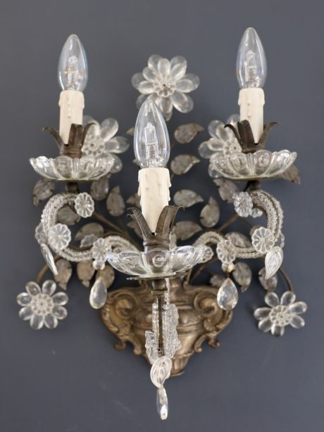 Brass and crystal sconces in the style of Maison Baguès