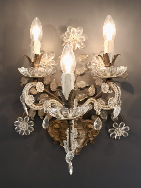 Brass and crystal sconces in the style of Maison Baguès