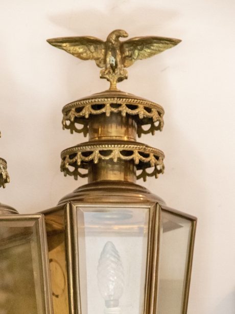 A pair of Antique brass coach lamps with eagle finials c.1900