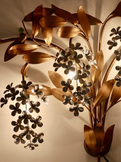 A mid-century gilt metal floral wall sconce