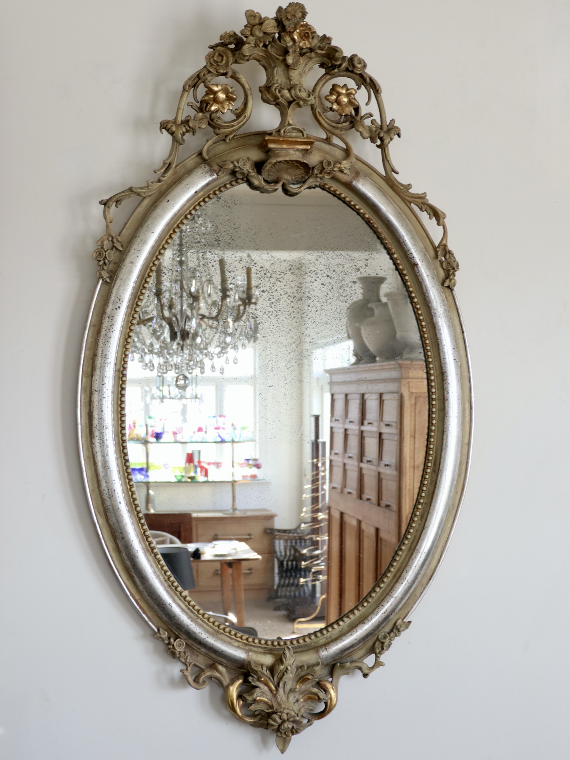 Louis Philippe oval silver leaf mirror in the Regency style